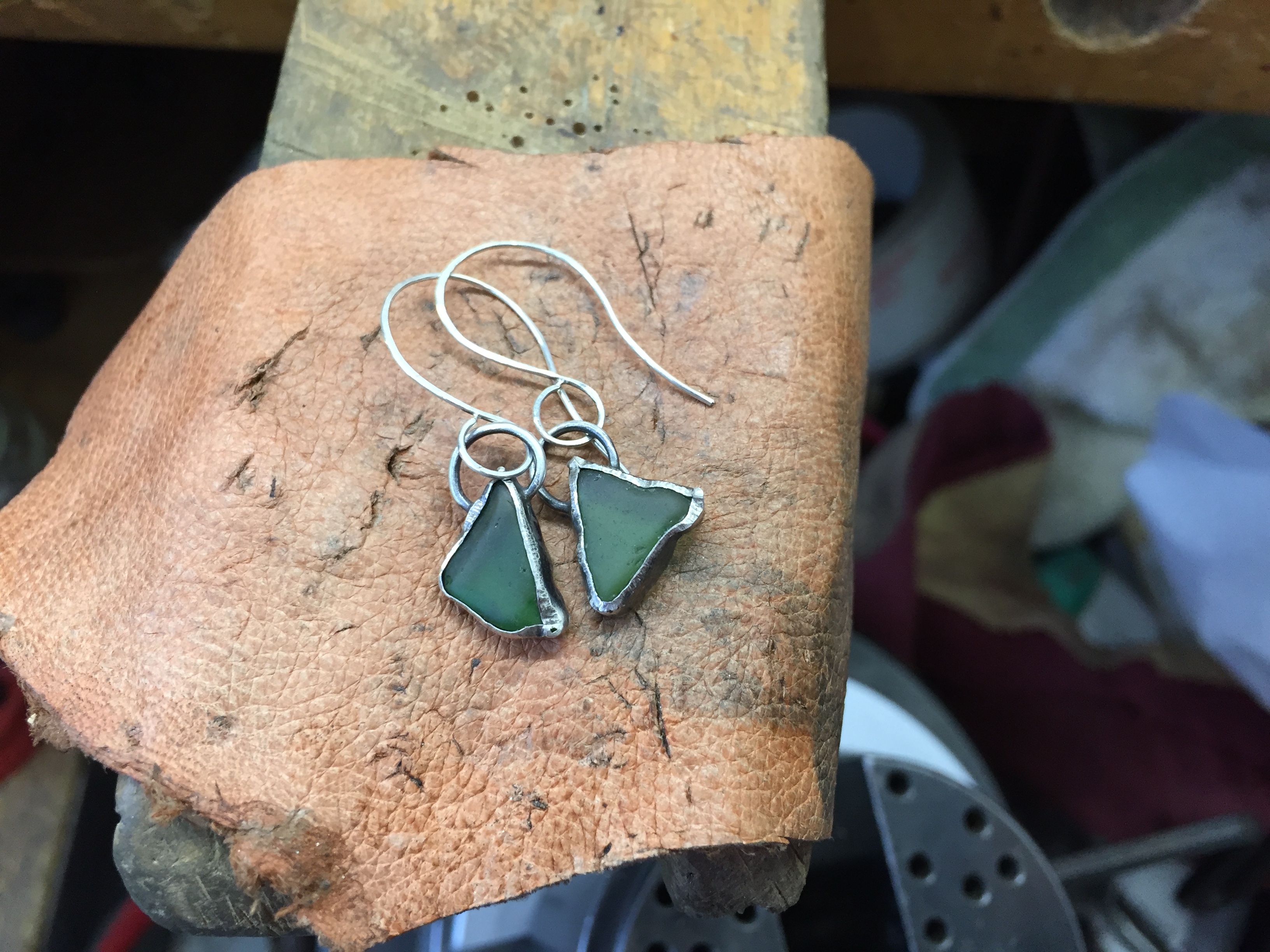 Green stone earrings with a silver backing